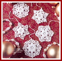 These crocheted snowflakes have rose centers and pearl bead accents.